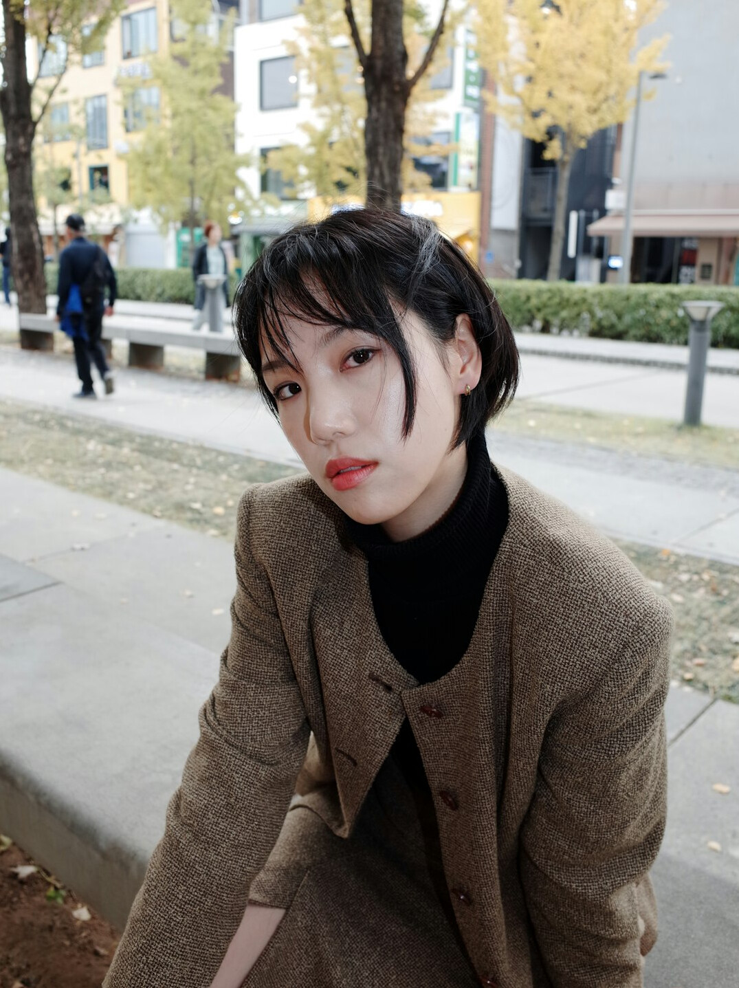 Portrait of a middle-aged woman with short brown hair in a blazer
